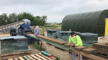 AECT 3500 model CEB machine making 10" x 14" earth blocks