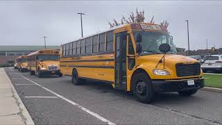 First Student and Durham School Services School Buses leaving the High School