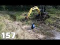 Beaver dam removal with excavator no157  filling a hole in the stream bank