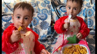 My little girl's first experience eating pasta and yogurt