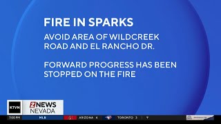 Firefighters stop forward progress on outside fire in Sparks
