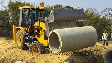 JCB 3DX Backhoe Lifting Heavy Culvert Pipe and Installing in Drain - Jcv video