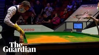 Commentator Rob Walker vacuum cleans snooker table after Just Stop Oil protest