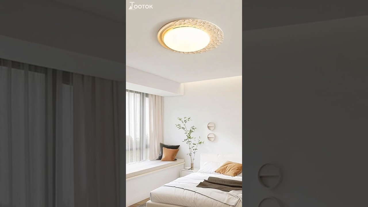 Versatile ceiling light : fits neutral spaces ,mixes textile texture with inviting illumination.