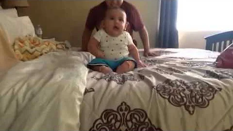 Cute baby falling sideways