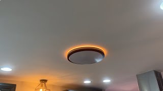 A modern light fixture with a Uplight