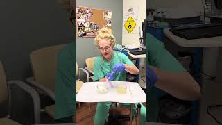 Demonstrating how to drain a breast cyst