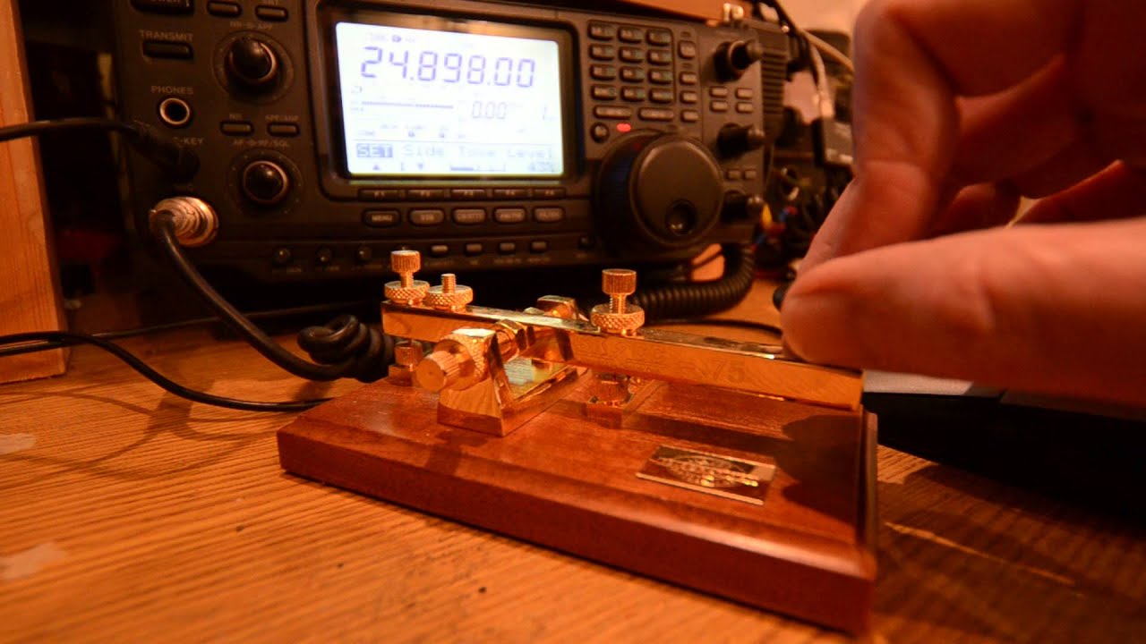 Practicing the alphabet and numbers in morse code using a straight key ...