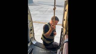 Why This Pilot Hanging Through Rope