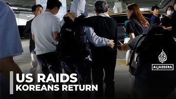 US immigration raids: South Koreans detained at factory return home