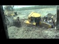 Caterpillar d8 bulldozer stuck in the mud cat d9 pull it out