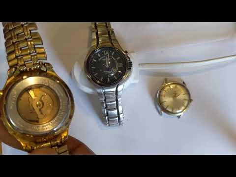 Charging a Seiko kinetic with a metal case back on a Braun charger - YouTube