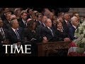 George w bush sneaks a piece of candy to michelle obama at the john mccain memorial service  time