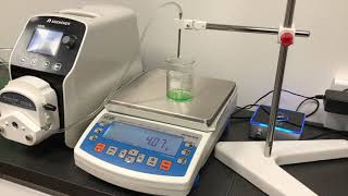 Accurate gravimetric filling system with a peristaltic pump LabN and a precision balance PS R2