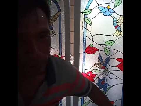 Sekat ruang tamu kaca  patri  stained glass rangka aluminium 