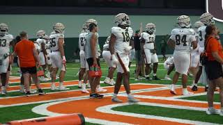 Miami football warms up before fall practice #7