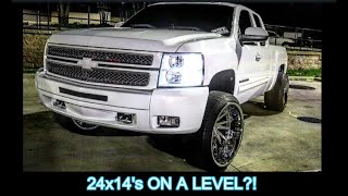 CHEVY SILVERADO LEVELED ON 24x14 and 305 35 streets