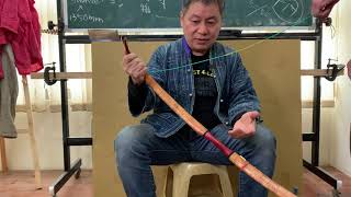String a horn bow with an assistant.