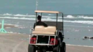liftedgolfcart on beach