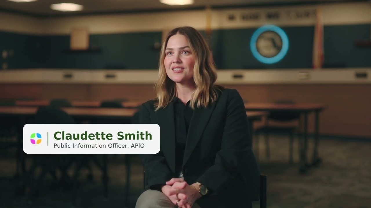 Video preview image of Staff member sitting in front of School Board office ; click to visit the ParentSquare post with the video