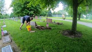 Leveling A headstone in the Cemetery