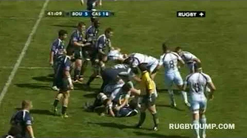 Referee David Rosich sandwiched between a prop and...