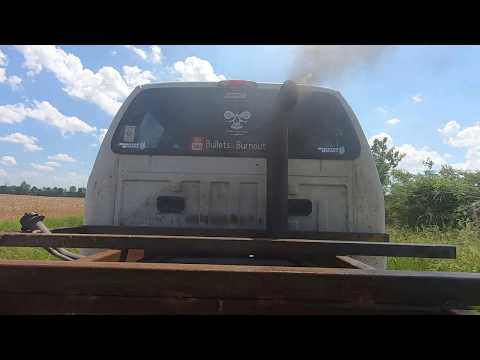 A YouTuber showing off their truck rolling coal using "all Sinister Diesel" parts.