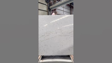 Create a stunning focal point with the dramatic Calacatta Antiqua quartz slab countertops.