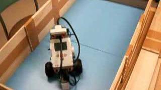 NXT robot runs around in the barricade