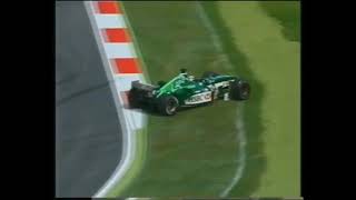 2002 F1 Malaysian GP - Eddie Irvine (Jaguar) broke front wing trying to lap Alex Yoong (Minardi)
