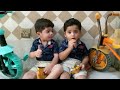 Funny Twins Eating Chips and Riding Bicycles