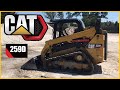 CAT 259D skidsteer pushing gravel