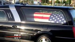 Photo shows veteran's coffin in hearse parked at Florida doughnut shop