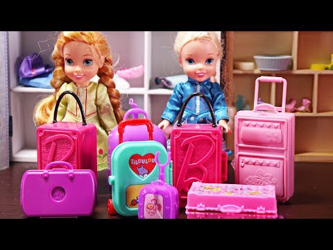 Elsa and Anna toddlers go on holidays and pack their suitcases