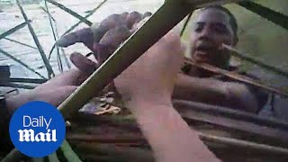 Body cam video shows moment cops found suspect hiding in swamp - Daily Mail