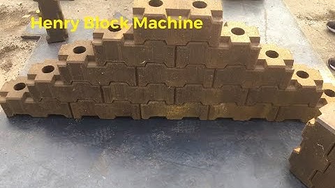 Hr2-10 automatic hydraulic clay interlocking brick machine test for Lego bricks before shipment.