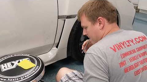 Hexis BodyfenceX PPF being applied to lower side fender piece.