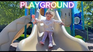Discover Kira's adventure with a toy baby on the playground.