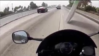 Motorcyclist Barely Misses Flying Object