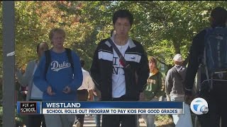 School pays students for good grades