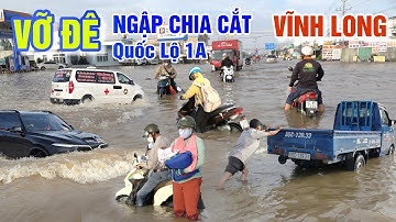 VỠ ĐÊ LŨ TRÀN NGẬP LỤT CHIA CẮT QUỐC LỘ 1A - XE TẢI ĐỨNG TRÂN HÀNG 100 XE MÁY DẪN BỘ Ở VĨNH LONG
