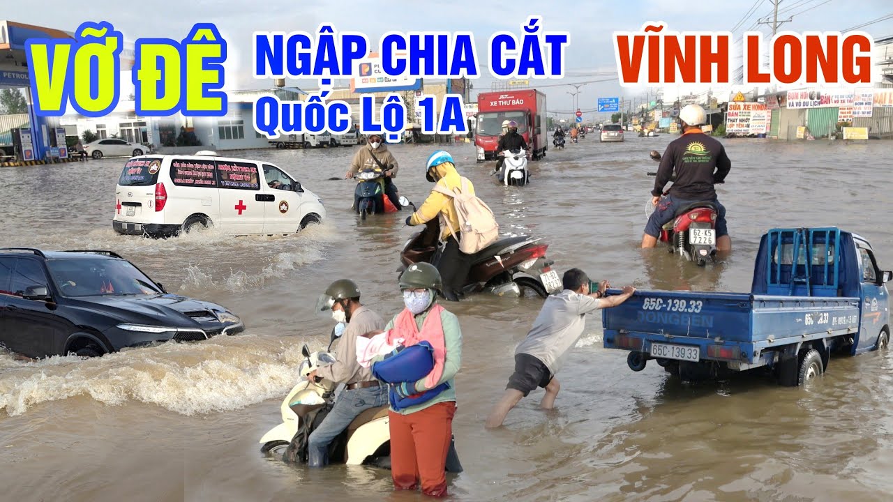 VỠ ĐÊ LŨ TRÀN NGẬP LỤT CHIA CẮT QUỐC LỘ 1A - XE TẢI ĐỨNG TRÂN HÀNG 100 XE MÁY DẪN BỘ Ở VĨNH LONG