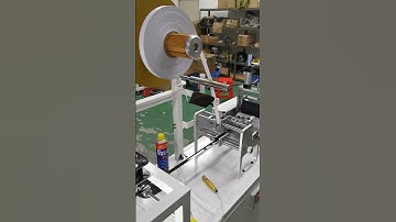 Automatic back adhesive hook and loop tape hotmelt glue adding machine