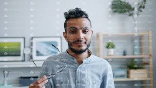 Slow Motion Of Arabian Guy Taking Off Gles Smiling Looking At Camera Indoors