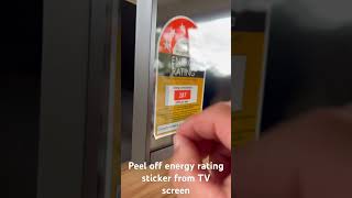 Peel off energy rating sticker from TV screen, LG50UR78