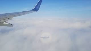 Omg caught in camera!! Flight shadow on the clouds with rainbow colors