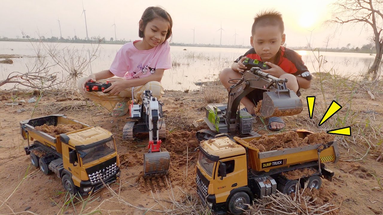 น้องโก๊ะพี่แอมป์เล่นแม็คโครบังคับขุดดินใส่รถดั้มแล้วไปเล่นยกล้อกัน