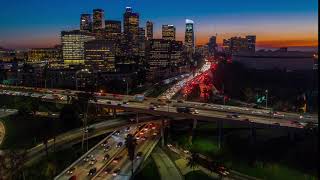 cinematic urban aerial time lapse of downtown los angeles freeway traffic with the