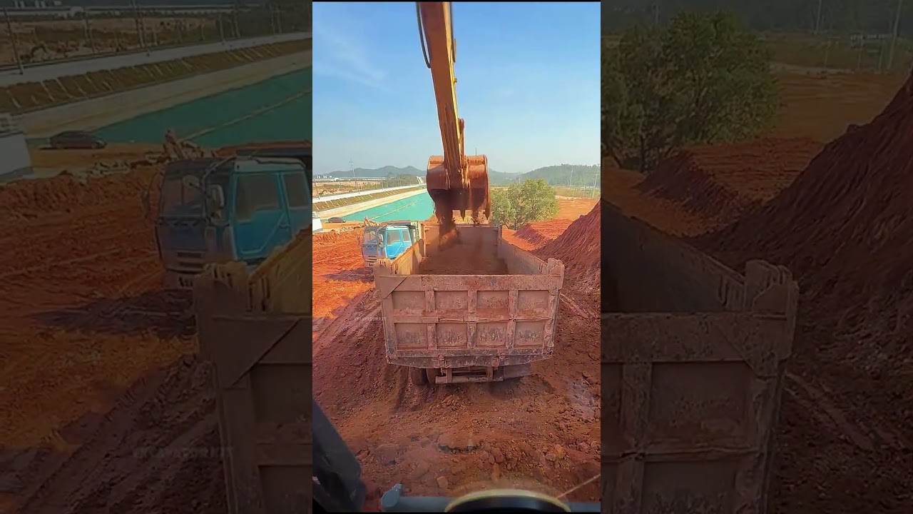 Excavators Load Soil Onto Trucks