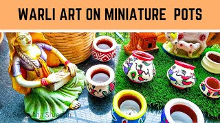 warli pot painting candle